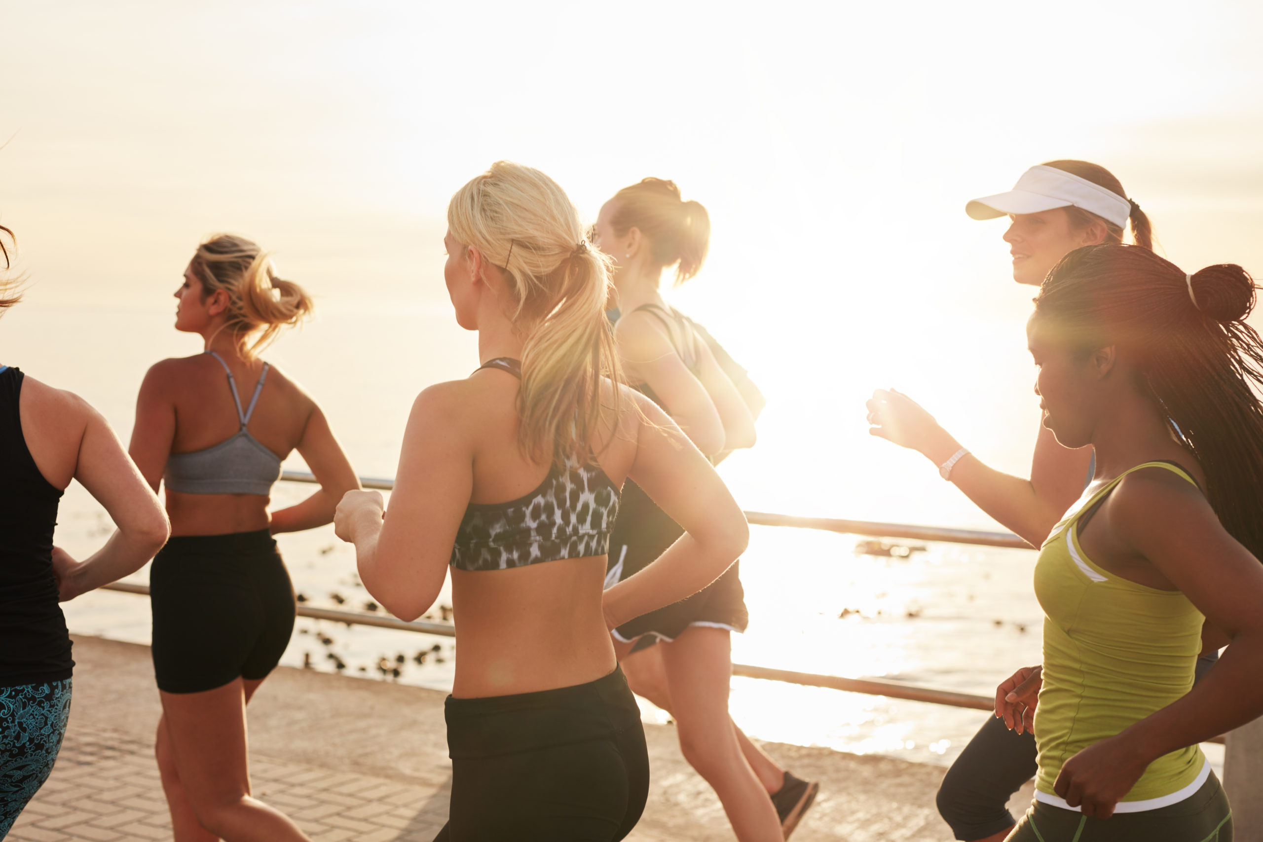 group-of-fit-young-women-running-together-2021-08-26-19-58-11-utc-scaled.jpg